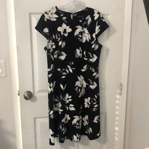 Black with white Aline shape dress with zipper on the back.